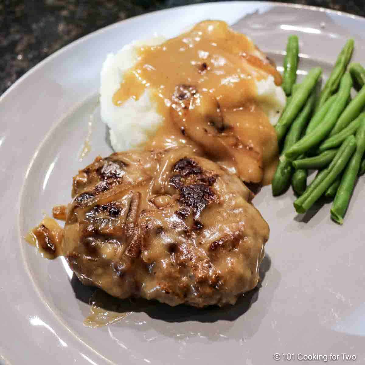 Salisbury steak with potatoes and gravy.