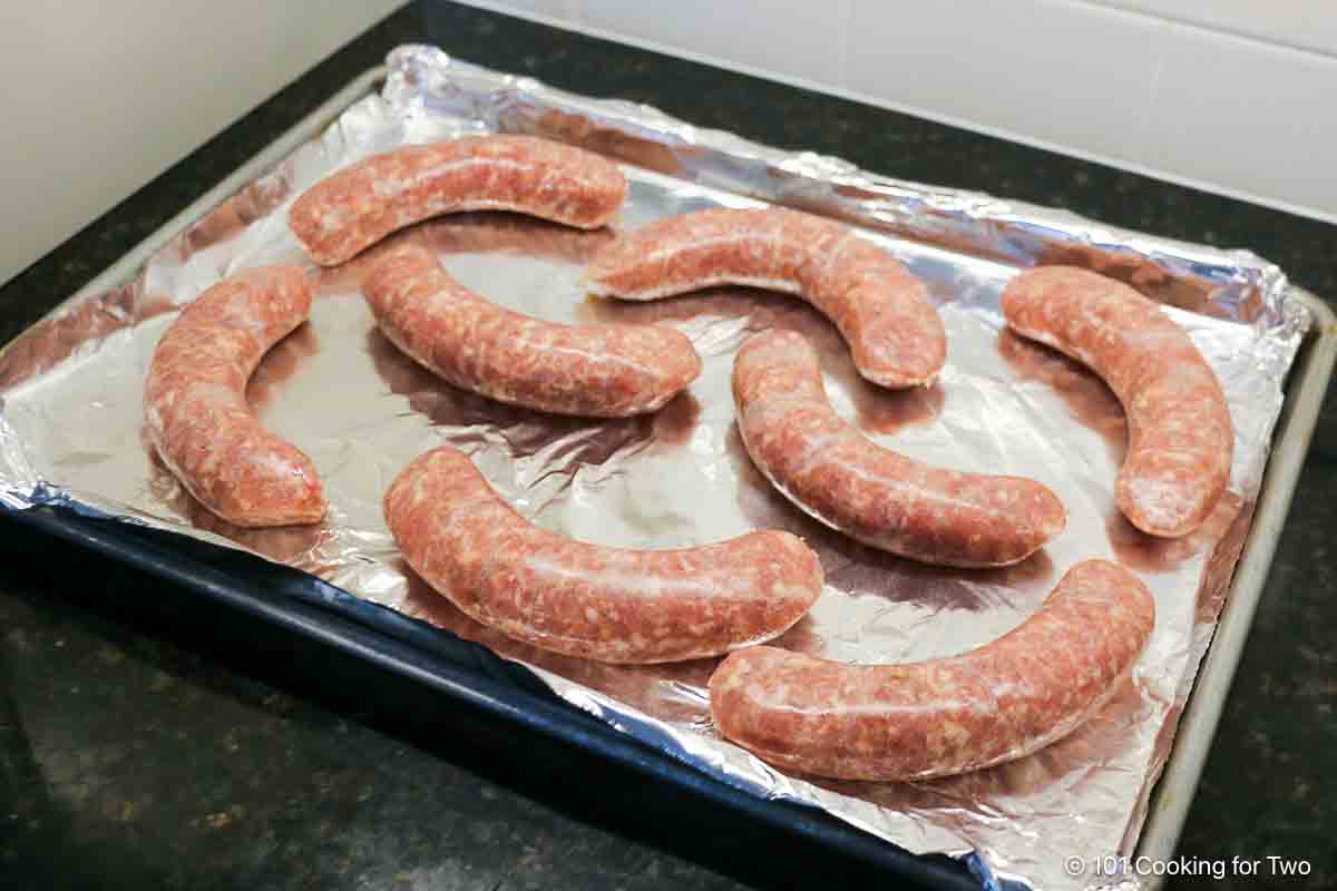 Raw Italian sausage on tray.
