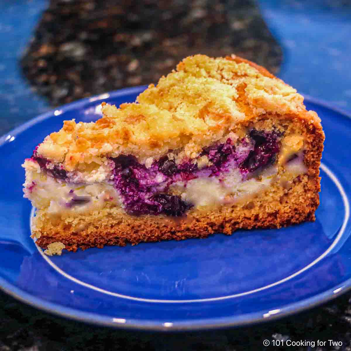 Blueberry Cream Cheese Coffee Cake on a blue plate.