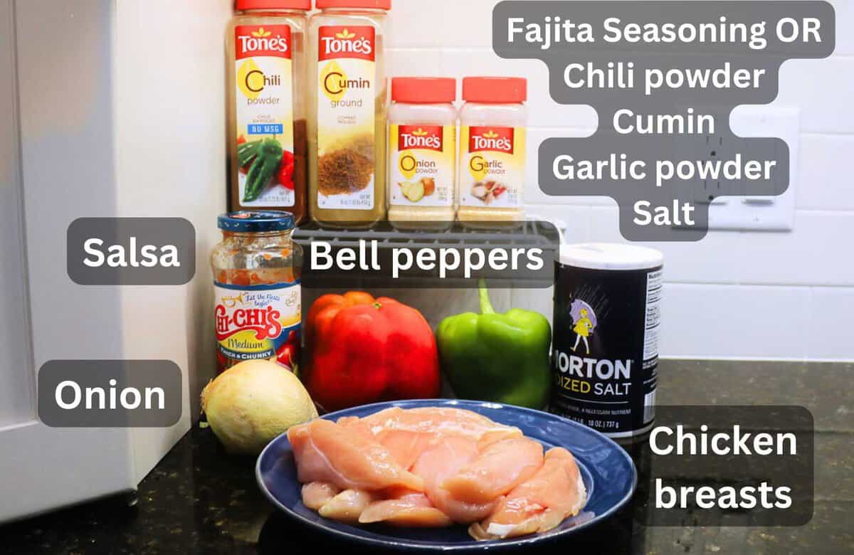 Raw chicken with fajita ingredients.