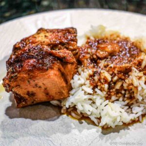 Honey garlic chicken with sauce on rice.