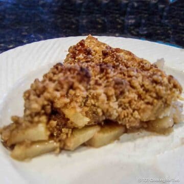 Slice of apple crumb pie.