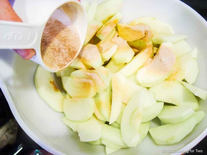 coating apple slices with cinnamon sugar.