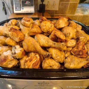 Pile of cooked chicken ready for a large party.