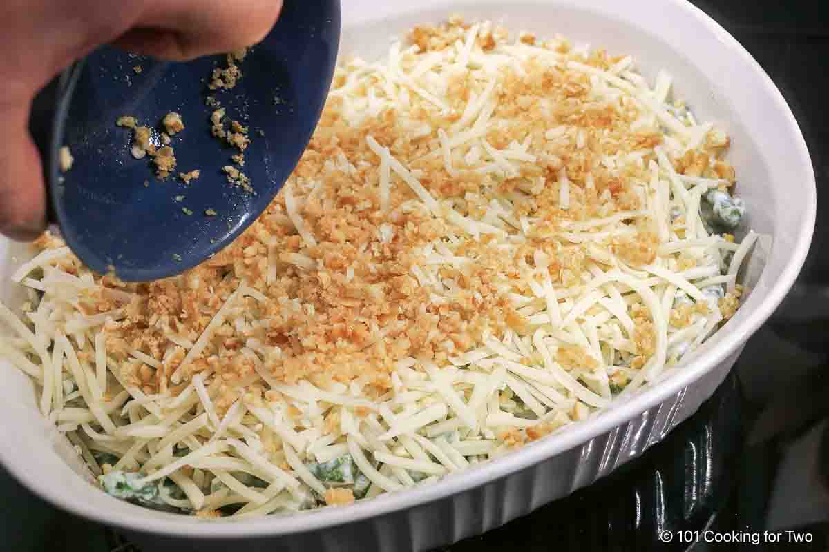 Top the casserole with cheese and crackers.