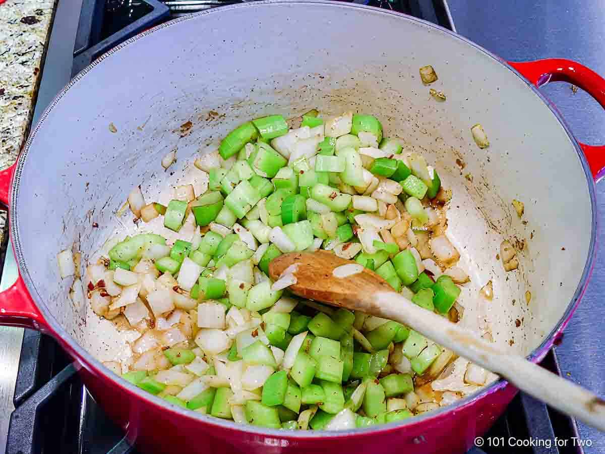 Browning onion and celery in sausage fat.