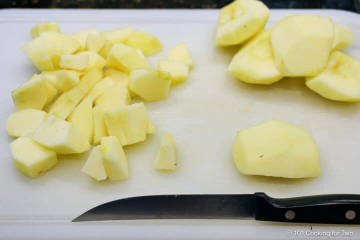 Chopped apples on a whiteboard.