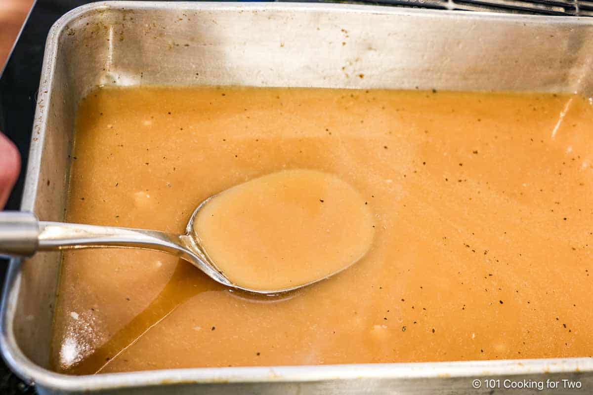 Mixing gravy until smooth.