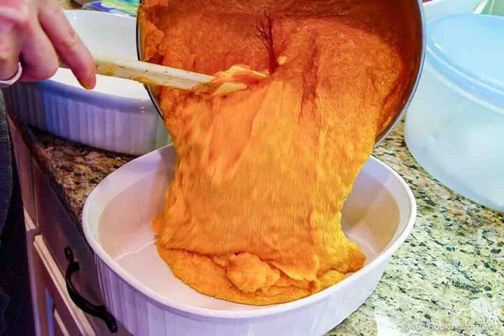 Pouring batter into a casserole dish.