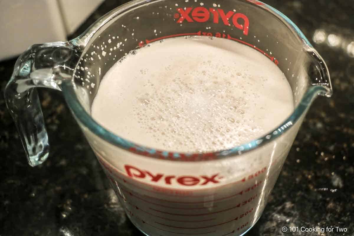 Proofing yeast in a measuring cup.