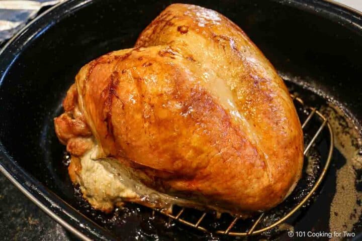 Roasted turkey breast in pan.