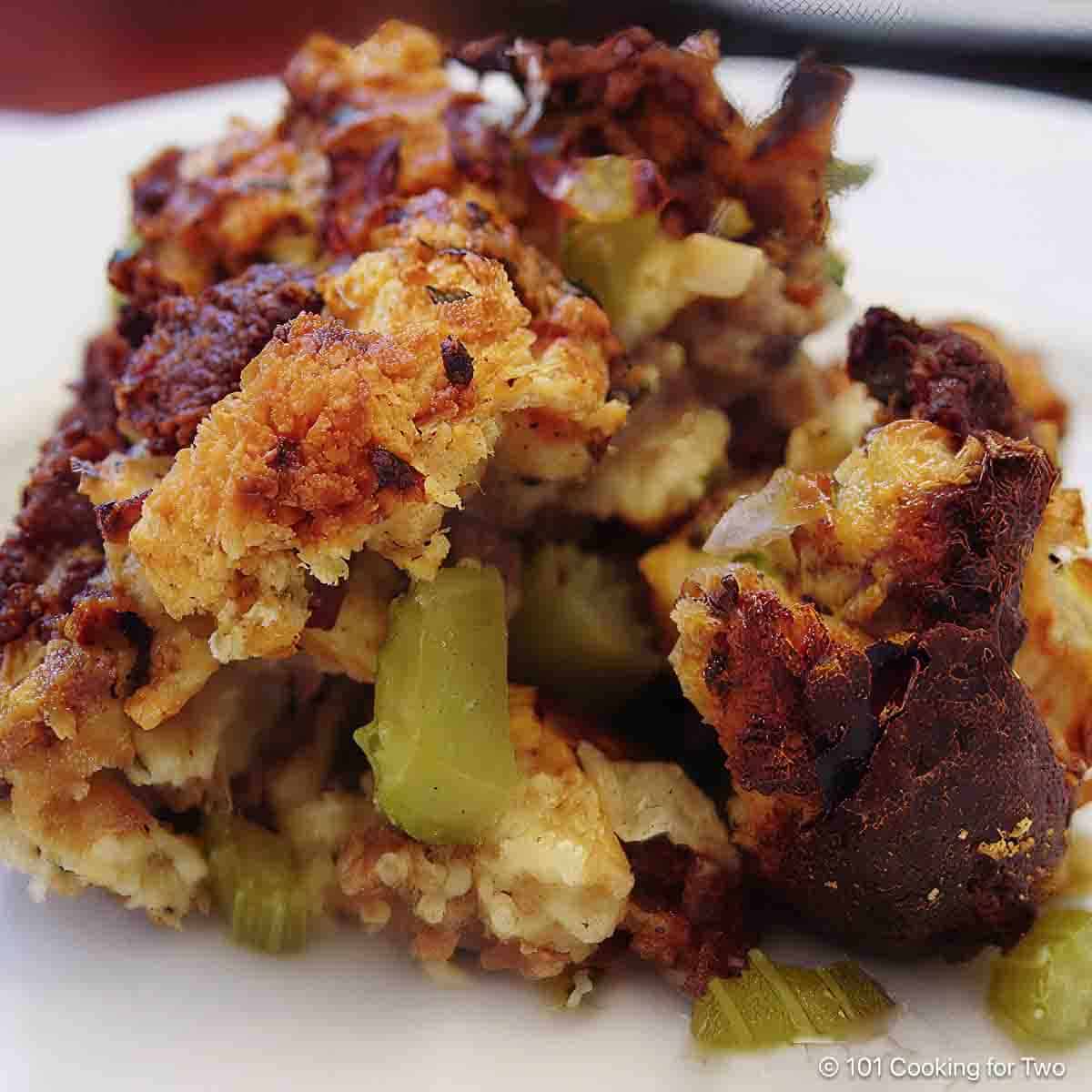 Sausage dressing on a white plate.