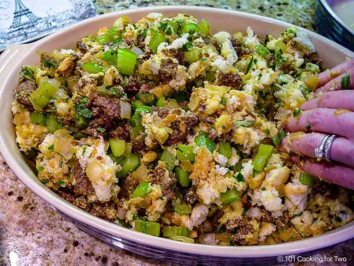 Spreading the dressing into a bowl.