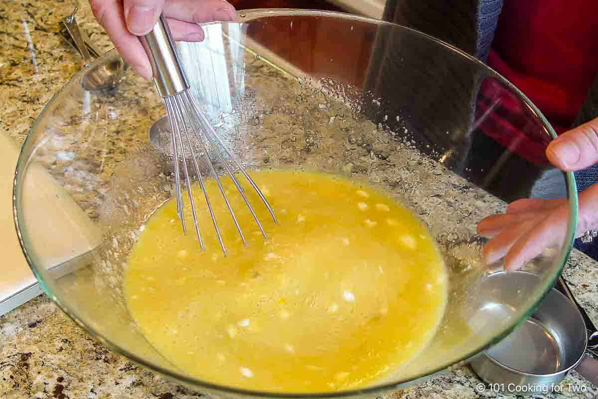 Whisking egg mixture.