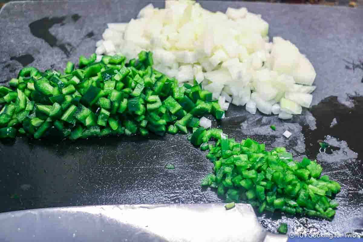 Chopped onion with poblano and jalapeno pepper.