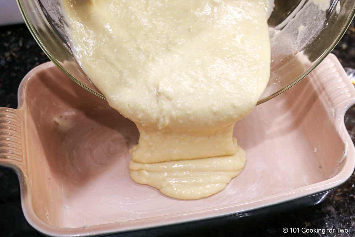 Pouring batter into the baking dish.