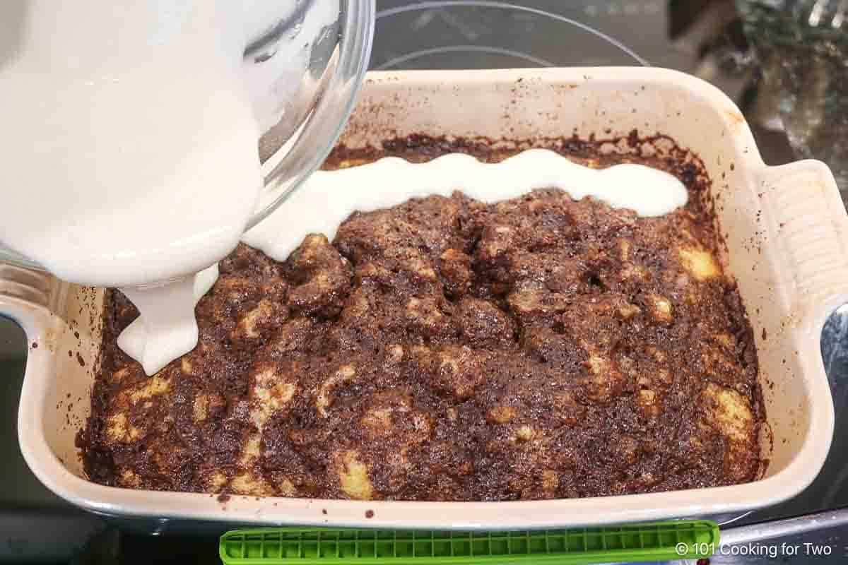 Pouring glaze over coffee cake.