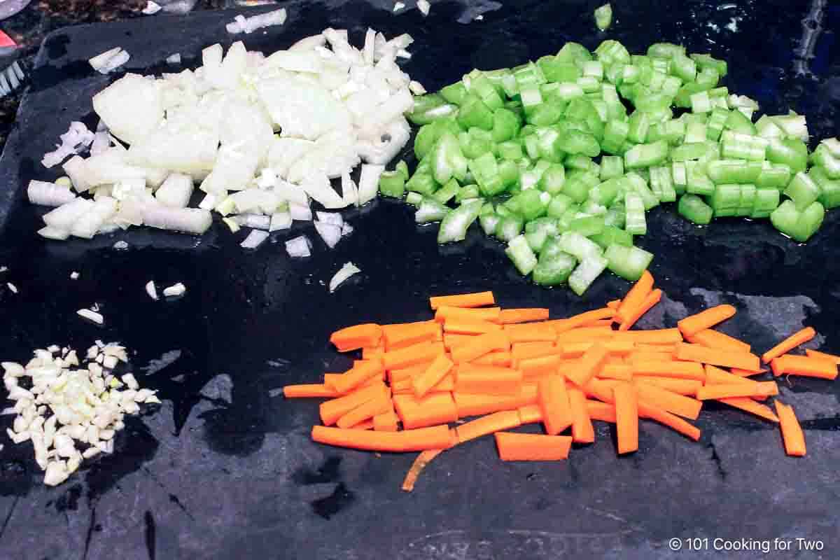 Prepared onion with celery, carrot and garlic.