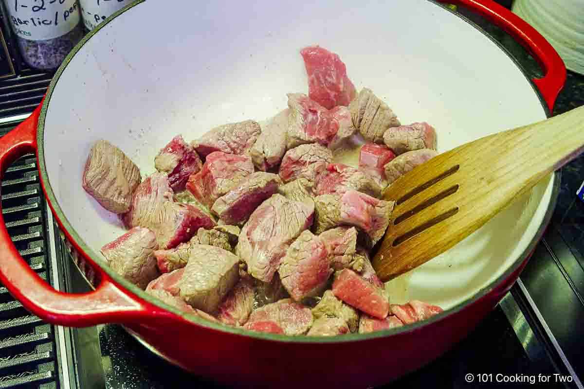 Browning stew meat in a Dutch oven.