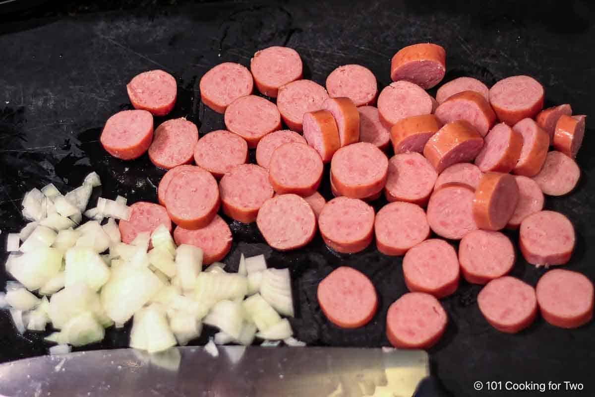 Chopped onion and sliced smoked sausage.