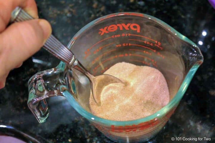 Mixing cinnamon sugar coating.