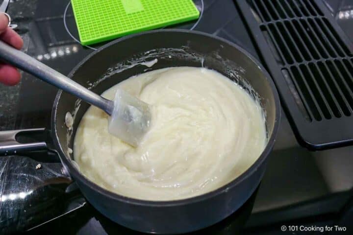 Stirring the melting chocolate in the sauce pan.