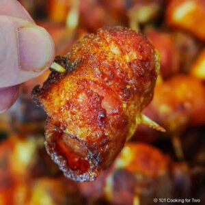 Bacon-wrapped chicken bite on a toothpick,