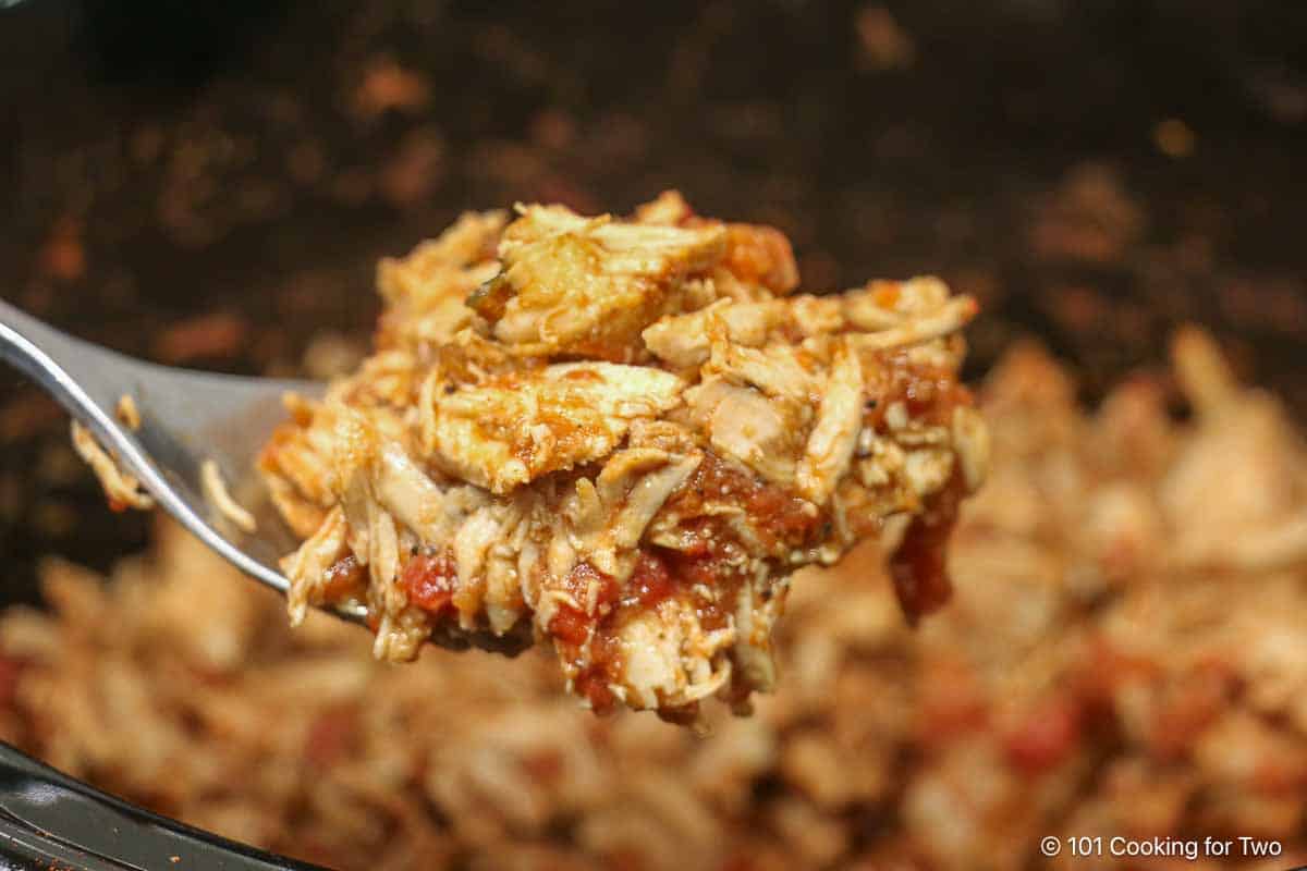 chicken taco meat on a spoon