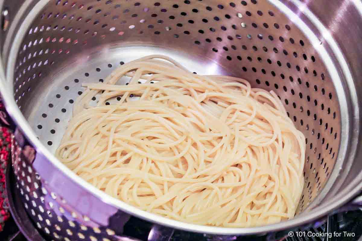 Cook spaghetti and drain.