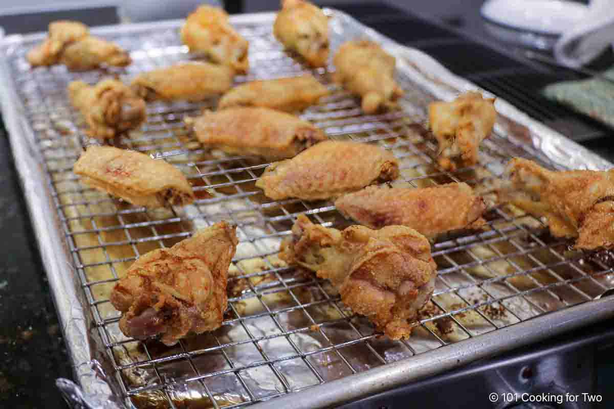 Crispy baked wings on the baking tray.