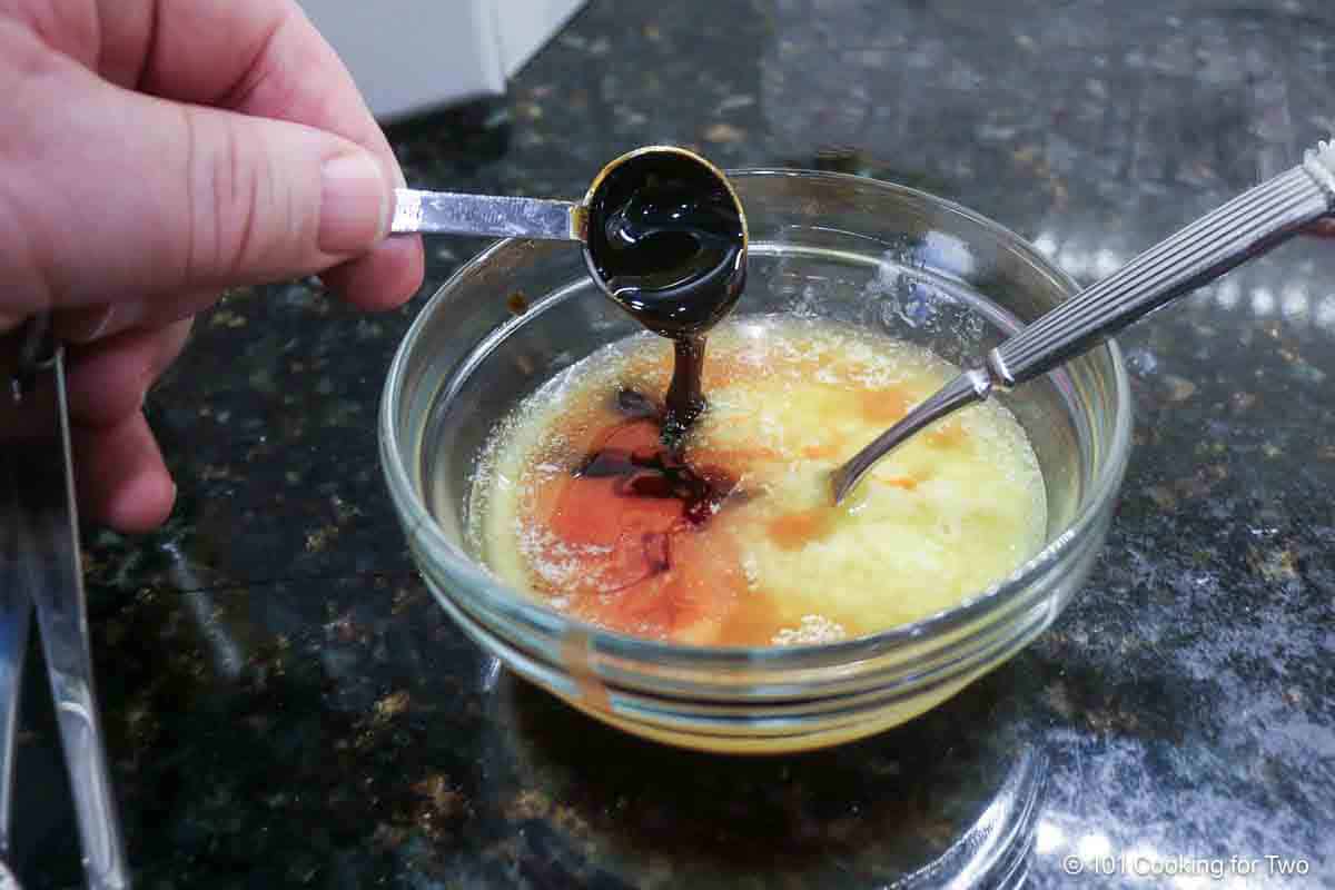 Mixing coating sauce in a small glass bowl.