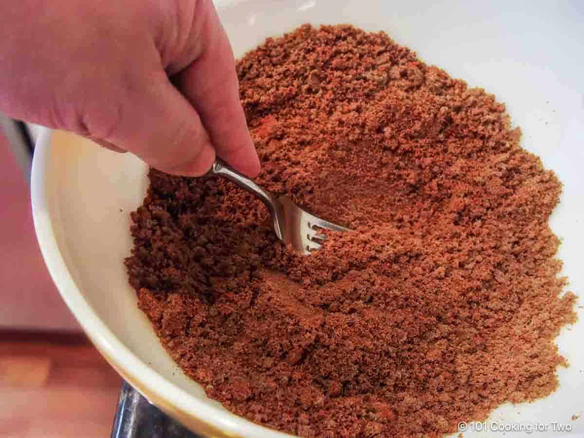 Mixing the coating of brown sugar and spices.