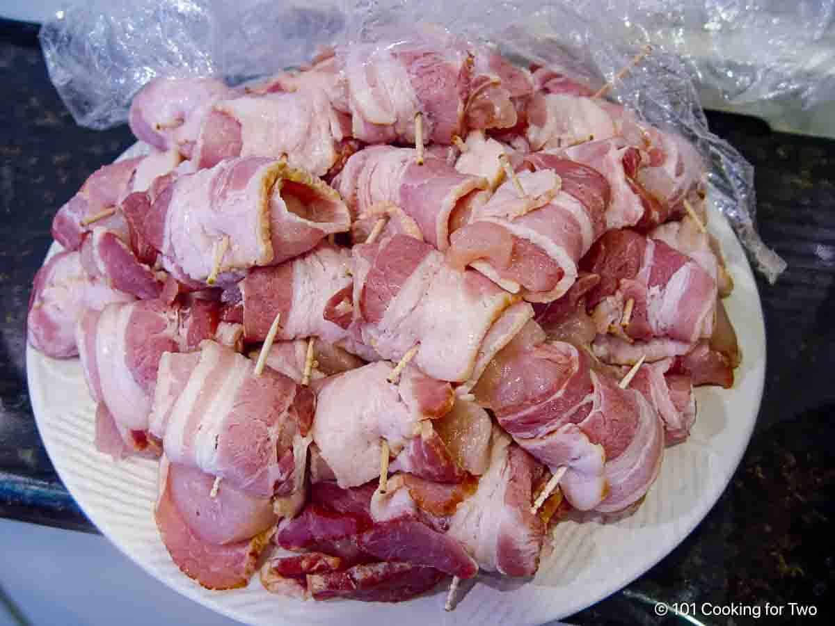 Pile of bacon and chicken wraps.