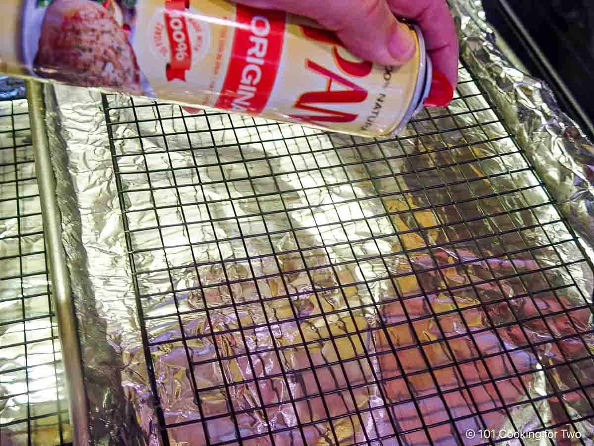 Preparing a tray with foil and a rack.