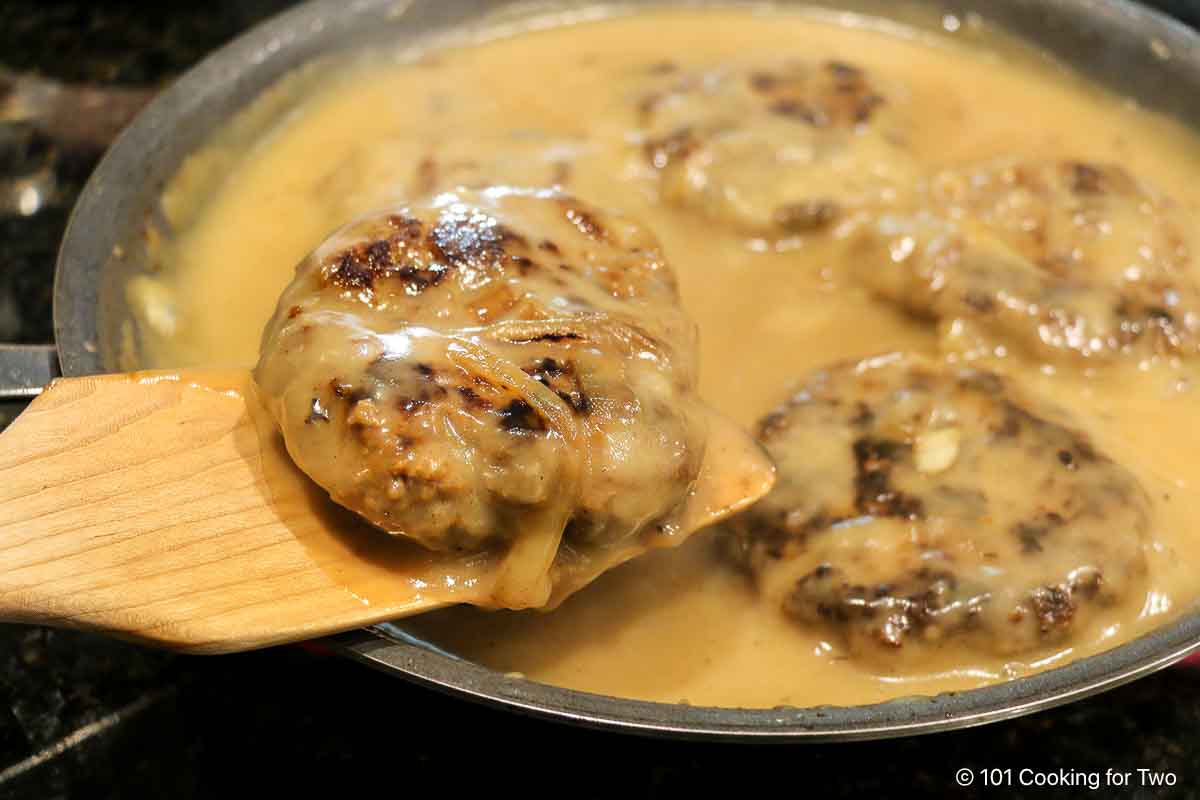 Salisbury steak on a spatula.