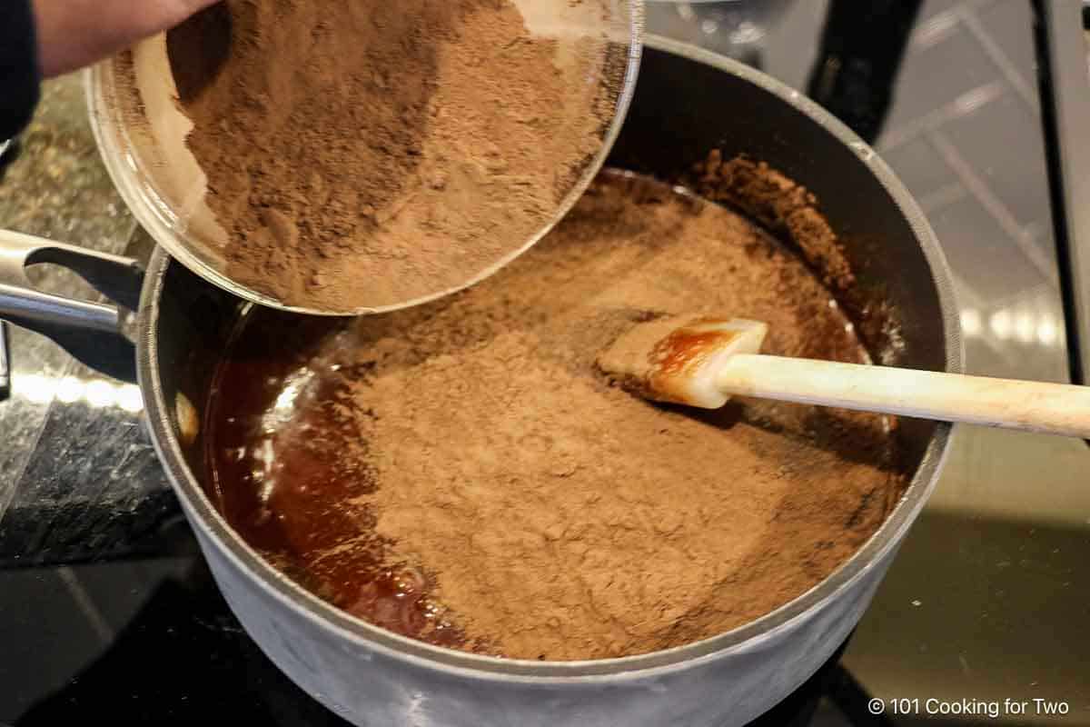 Adding the cocoa to the batter.