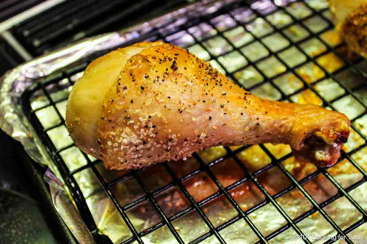 Baked chicken drumstick on the tray.