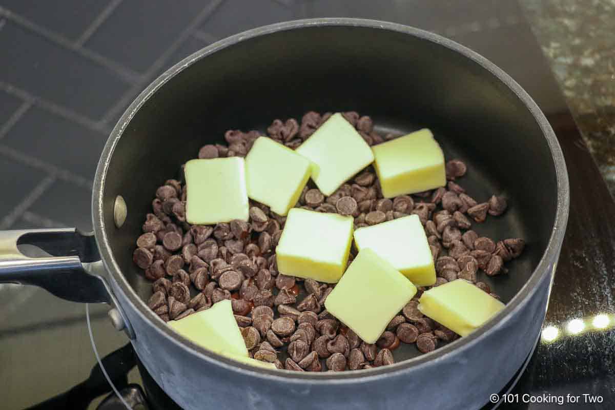 Chocolate chips and butter in a sauce pan.