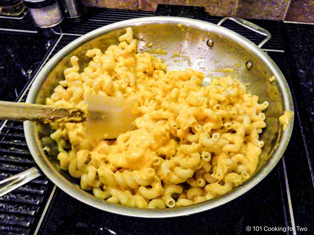 Frying mac and cheese in a large skillet.