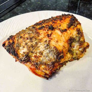 Baked Herbs de Provence chicken on a plate.